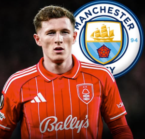 Nottingham Forest footballer in a red kit on the field, with a Manchester City crest visible in the background.