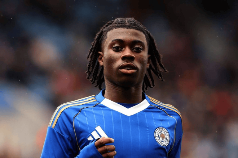Soccer player in a blue Leicester City jersey on the field, looking ahead.
