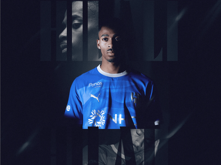 Portrait of a male football player in a blue jersey facing the camera, with a dark, glitchy vertical-bar overlay across the image.