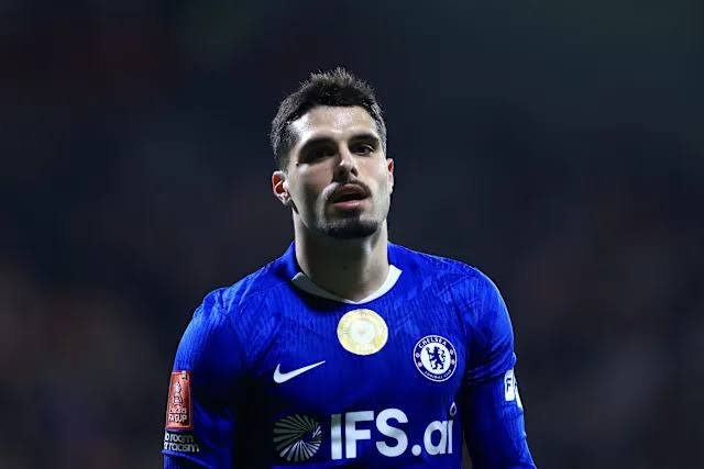 Chelsea FC player in a blue kit on the pitch during a match.