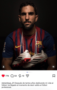 Portrait of a man in a FC Barcelona jersey, holding white and black soccer cleats in front of a dark background with a focused expression.